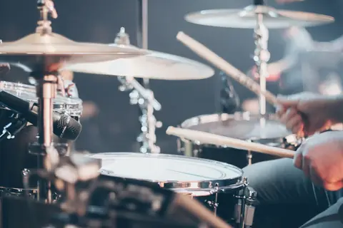 Drummer playing a kit
