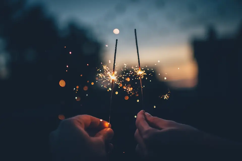 Two sparklers at dusk