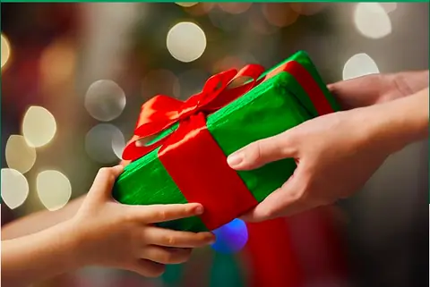 Hands exchanging a wrapped gift
