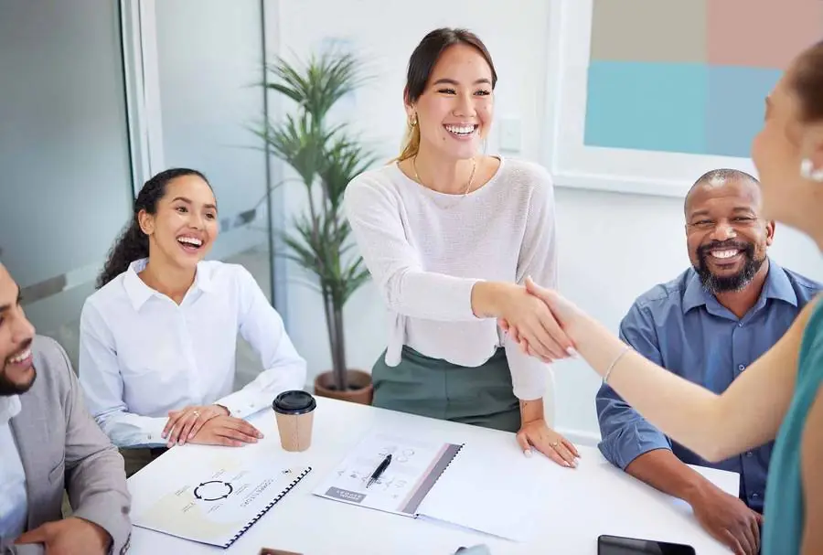 Colleagues meeting around an office table